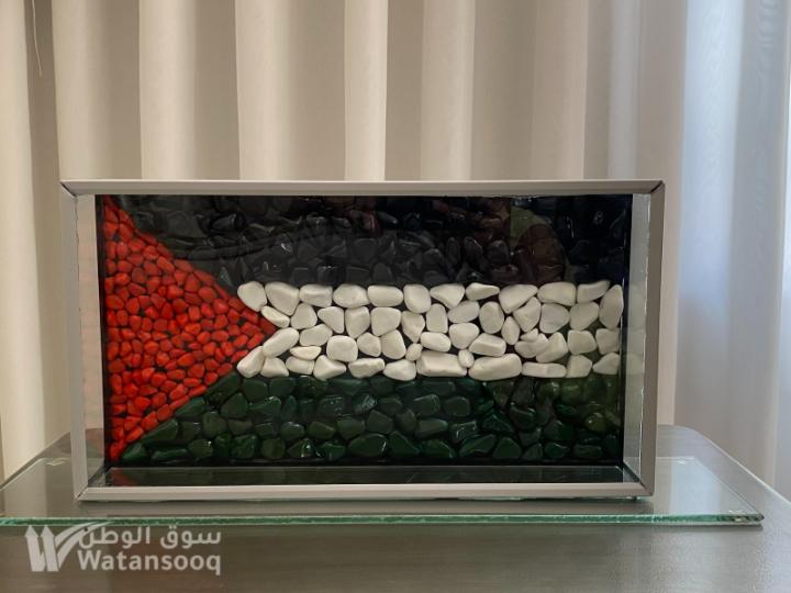 علم فلسطين... محفور بالحجارة وبالحب